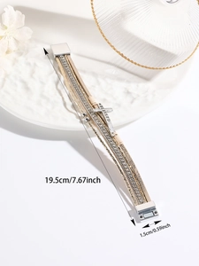 Detail of multi-layer PU leather bracelet with rhinestone cross and Blessed engraving