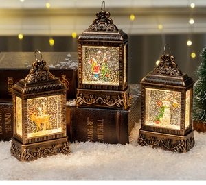 Vintage bronze Christmas lanterns with glitter snow globe scenes of Santa and Reindeer