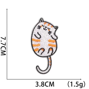 Detail of embroidered cartoon orange cat patch with 7.7cm by 3.8cm size measurements
