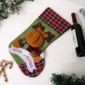 Detailed view of burlap Christmas stocking featuring a 3D reindeer and Merry Christmas banner