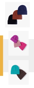 Detailed close-up showing texture of thick knit beanies in multiple vibrant colors