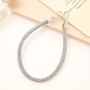 Close-up of grey woven PU leather strap with silver metal hooks for handbag accessories
