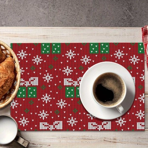 Christmas snowflake table mat with red knitted pattern for festive holiday dining decor
