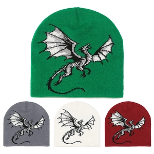 Close-up of winter knit beanies featuring cartoon dragon patterns in four color options