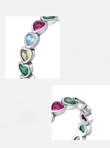 Macro shot of S925 sterling silver stamp and colorful heart-cut zircons on a vintage ring
