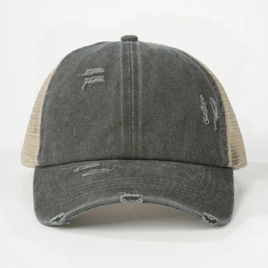 Detail view of distressed grey denim brim with vintage holes and beige mesh panels