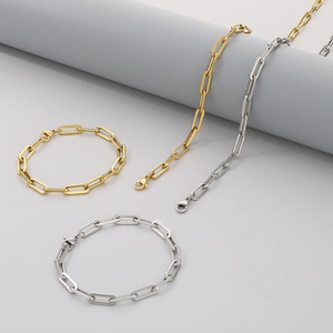 Detail of square link necklaces and bracelets in gold and silver finish with lobster clasp