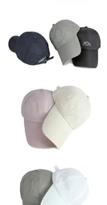 Detailed view of quick-dry baseball caps with breathable mesh holes and mountain embroidery
