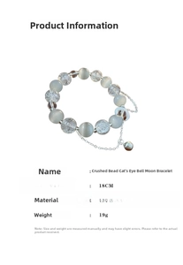 Detail view of vintage moon bracelet with cat-eye stone, bells and cracked beads