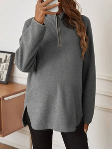 Detail of gray fleece fabric on maternity quarter-zip long sleeve top for women