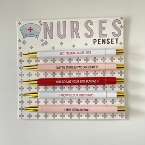 Detailed set of 5 nurse-themed pens with humorous phrases on a decorative card