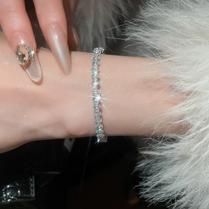 Close-up of sparkling cubic zirconia bracelet on wrist with elegant silver-tone finish