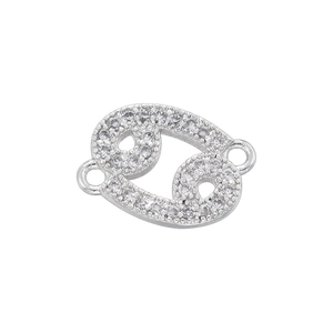 Close-up of silver Cancer zodiac connector with white zircons for DIY jewelry making