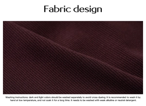 Detail of dark red ribbed knit fabric texture with English washing instructions