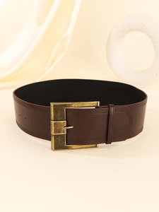 Detail view of dark brown leather wide waist belt with antique bronze metal buckle