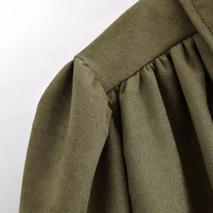 Olive green suede cropped jacket with detailed shoulder pleats and premium macro texture