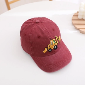 Close-up of yellow excavator embroidery on a washed cotton baseball cap for boys