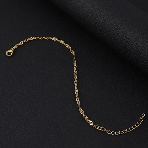 Detailed close-up of 18K gold plated stainless steel water wave chain with lobster clasp