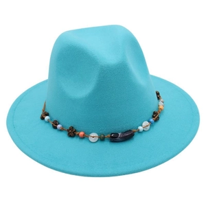 Detail of teal fedora hat showing bohemian beaded band with wooden beads and metal floral spacers