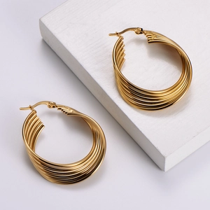 Golden multi-layer geometric twisted hoop earrings in a minimalist stainless steel design
