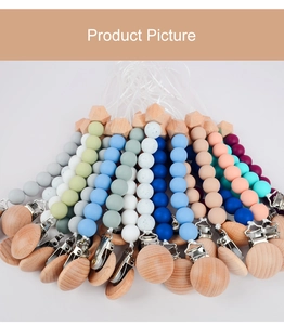 Macro detail of silicone and beech wood octagon beads on baby pacifier clip chains