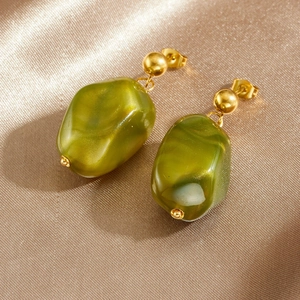 Retro geometric olive green resin pendant earrings with golden ball studs on satin