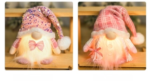 Detail of pink LED Christmas gnomes with glowing warm lights and sequins