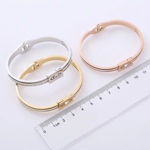 Elegant evil eye bangle in silver gold and rose gold with pavé set crystals for women