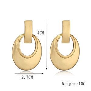 Detail view showing dimensions 4cm x 2.7cm and weight 10g of golden geometric earrings