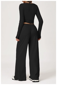Detail of the high-waisted wide-leg trousers and fitted back-tie design on the yoga set
