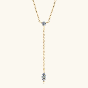 Detail of golden S925 silver Y-shaped necklace with round and marquise zircon pendants