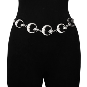 Close-up of a silver moon and star metal waist chain on a black mannequin body