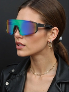 Close-up of matte black shield sunglasses with rainbow gradient lenses and sleek frame