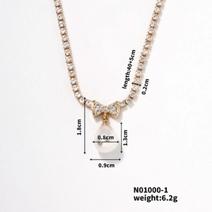Detailed size specifications for gold pearl necklace with bow pendant and measurements
