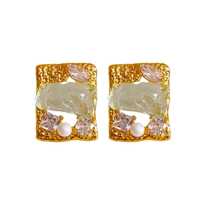 Gold-plated earrings with irregular green resin, white pearls, and sparkling cubic zirconia