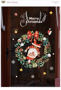Detail view of Merry Christmas wreath window decal with Santa Claus on a glass door