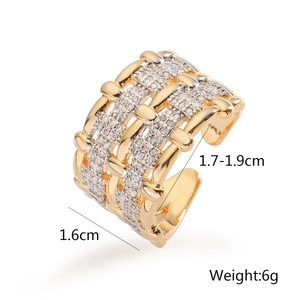Detail of wide two-tone woven ring with cubic zirconia and multi-layer geometric design