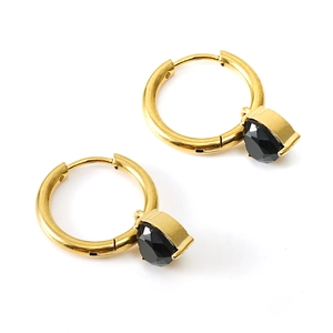 Vintage gold hoop earrings with black pear-shaped zircon stones on a white background
