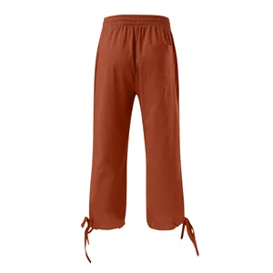 Detail of elastic waist and adjustable drawstring hem on linen wide-leg casual pants