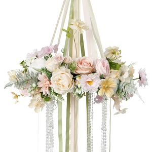 Floral hanging decoration with faux peonies, roses, and ribbons for wedding party decor