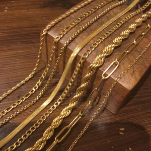 Set of 18K gold stainless steel layered necklaces including figaro and snake chains