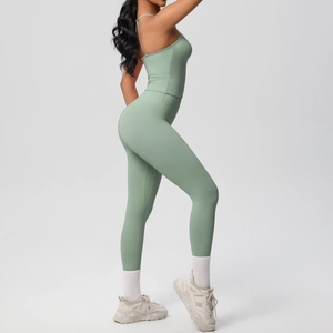 Side view of light green two-piece yoga set showing slim fit vest and high waist leggings