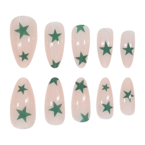 Green star press-on nails in long almond shape with semi-transparent pink base