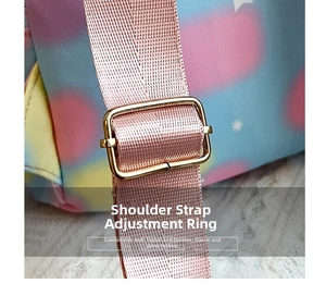 Detail of adjustable gold buckle and pink strap on colorful gradient heart backpack
