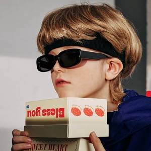 Kids polarized sunglasses with black frames and sports headband for UV protection