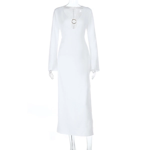 Close-up of white knitted maxi dress featuring deep V-neckline with metal ring detail