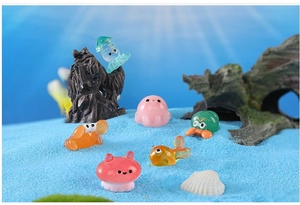 Miniature resin ocean animals set with octopus and crab on blue decorative sand