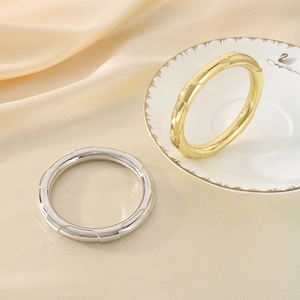 Polished hollow stainless steel bamboo style bangles in gold and silver finish
