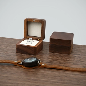 Premium walnut wood ring box with white velvet lining and two slots for jewelry storage