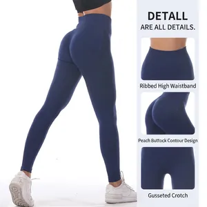 Navy blue high waisted yoga pants with peach butt lift and ribbed seamless waistband
